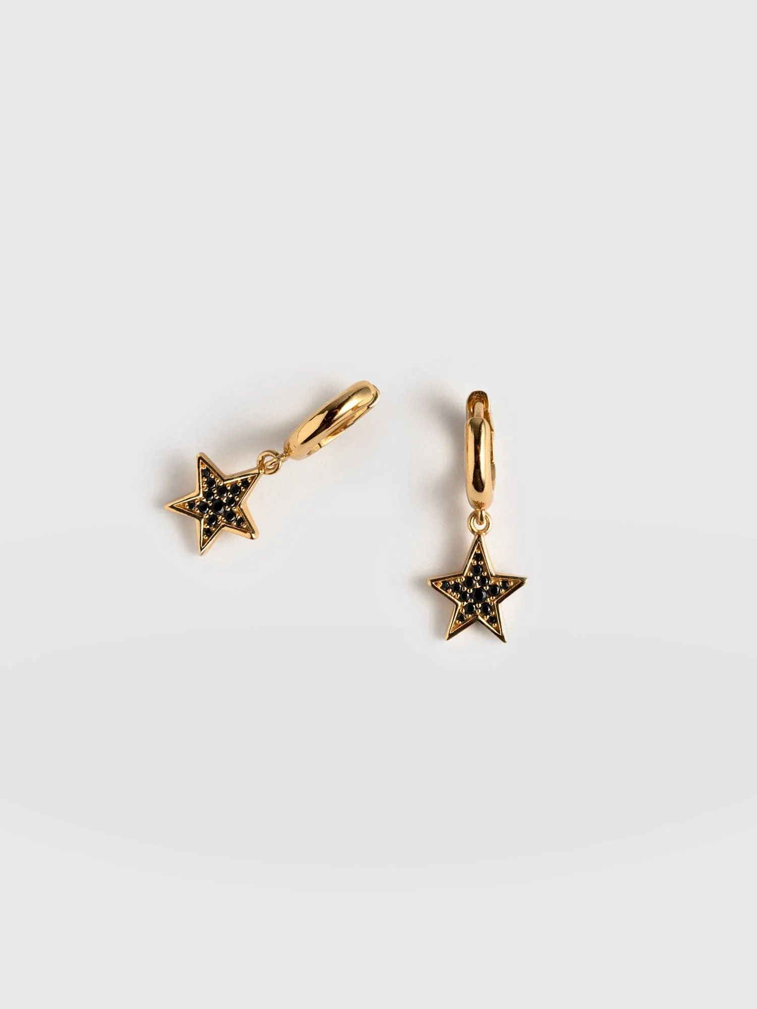 611-astral-star-charm-drop-huggie-earrings-gold-black-1.webp