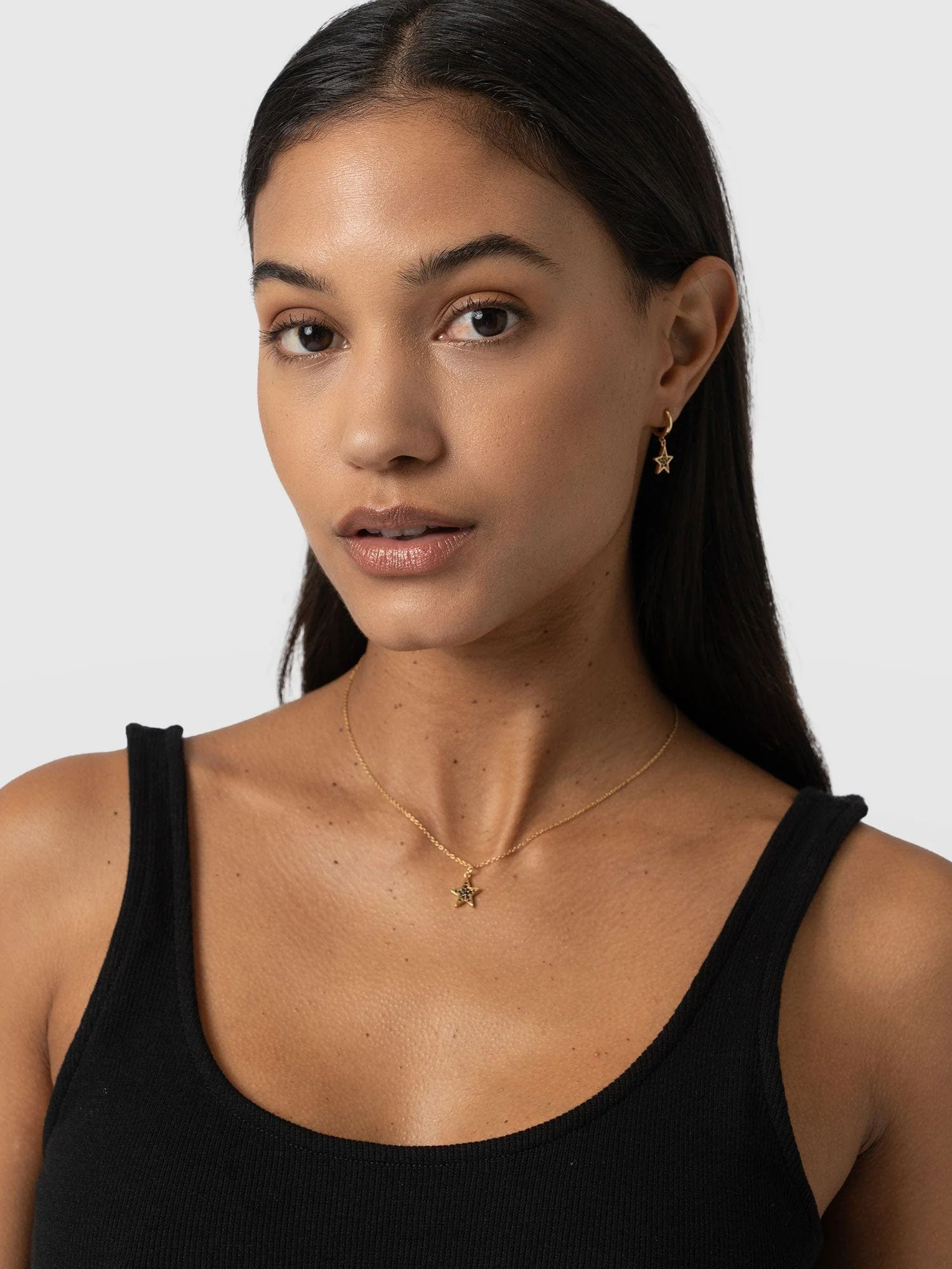 613-astral-star-necklace-gold-black-1.webp