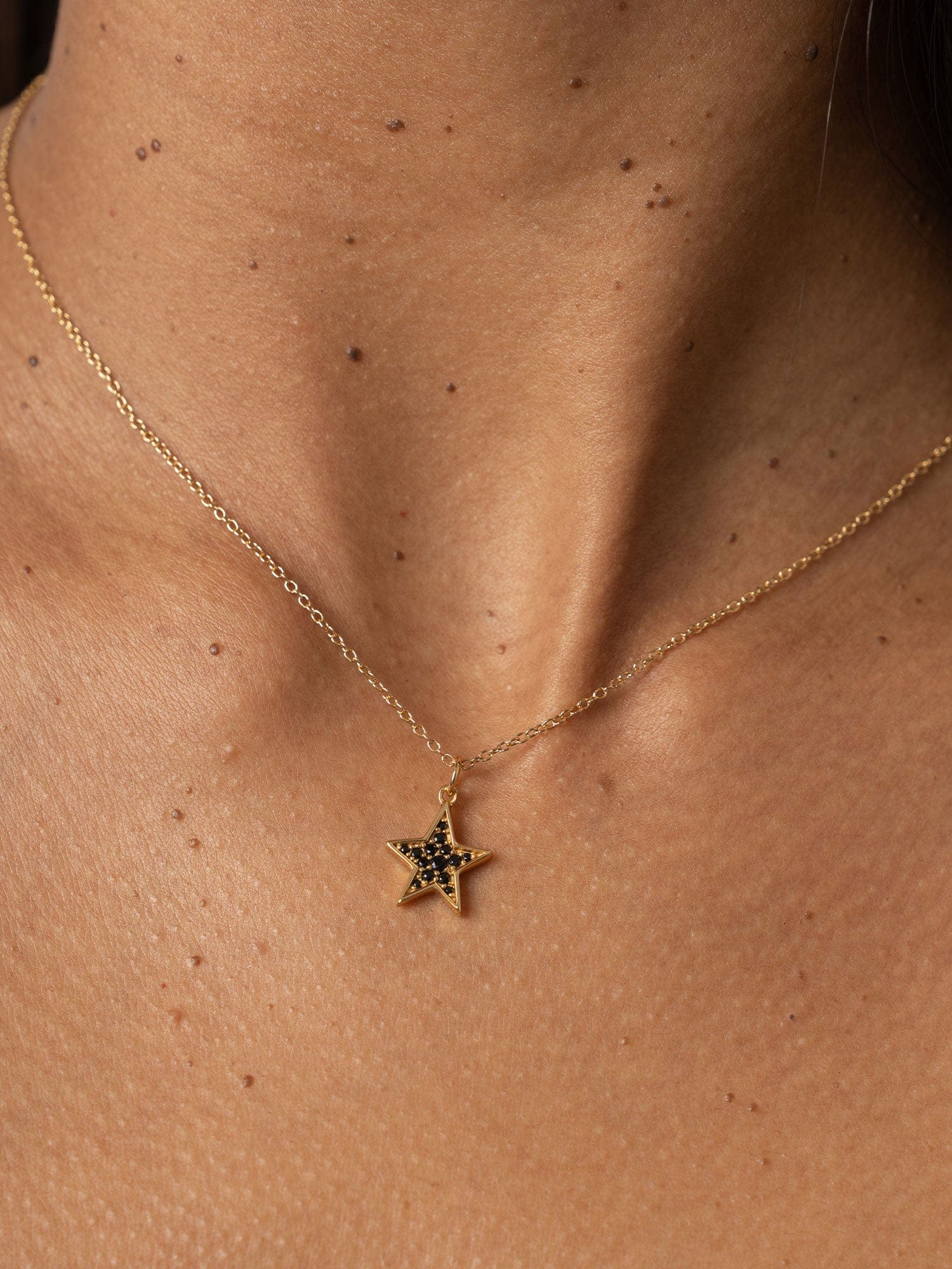 613-astral-star-necklace-gold-black-1.webp